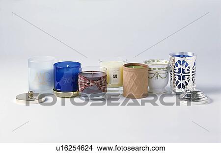 Close-up of a collection of glass and terracotta and silver candle holders View Large Photo Image Picture - Close-up of a collection of glass and terracotta and silver candle holders. Fotosearch