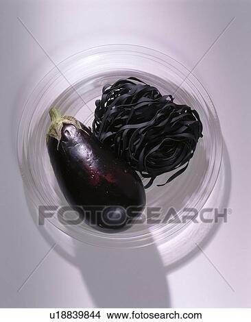 Close-up of aubergine and dried black pasta in glass dish View Large Photo Image Picture - Close-up of aubergine and dried black pasta in glass dish. Fotosearch