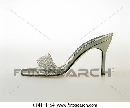 Close-up of backless silver stiletto shoe View Large Photo Image Picture - Close-up of backless silver stiletto shoe. Fotosearch