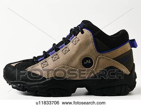 Close-up of beige and black trainer shoe View Large Photo Image Stock Photograph - Close-up of beige and black trainer shoe. Fotosearch
