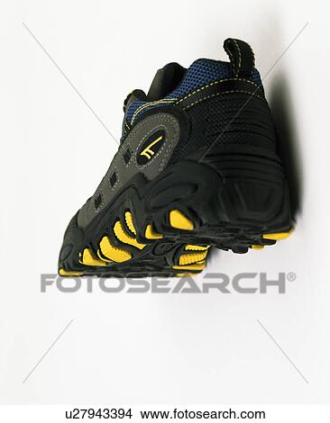 Close-up of black trainer shoe with yellow sole View Large Photo Image Picture - Close-up of black trainer shoe with yellow sole. Fotosearch