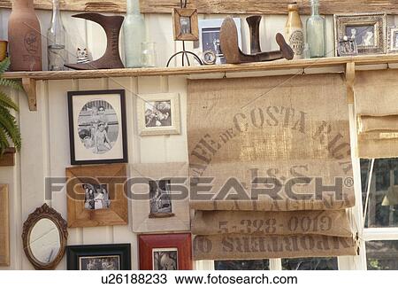 Stock Image - Close-up of blind made from old hessian sacks in cottage hall. Fotosearch