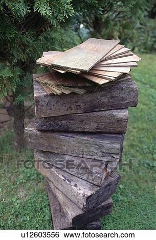 Close-up of block of wood piled into informal sculpture View Large Photo Image Stock Photograph - Close-up of block of wood piled into informal sculpture. Fotosearch