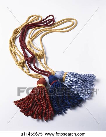Stock Photography - Close-up of blue and red silk tasselled tie-backs. Fotosearch