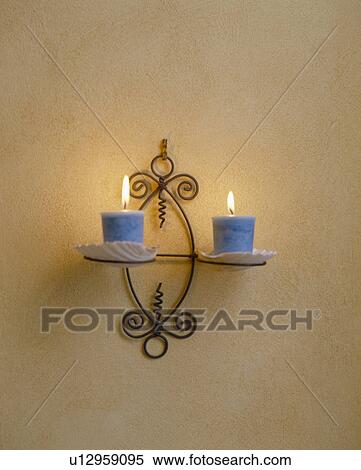 Close-up of blue candles on metal wall-sconce View Large Photo Image Stock Photography - Close-up of blue candles on metal wall-sconce. Fotosearch