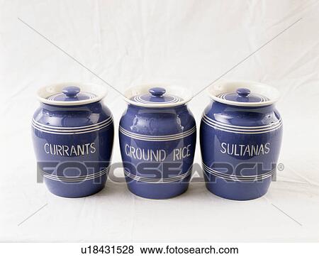 Stock Photo - Close-up of blue kitchen storage jars. Fotosearch
