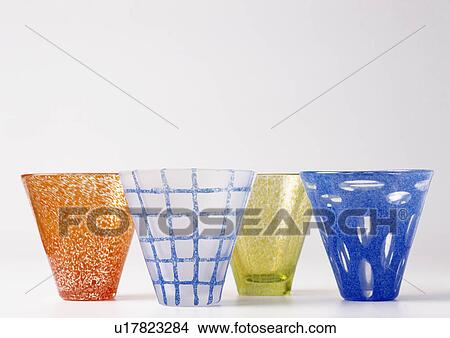 Close-up of blue, orange and lime-green hand-blown glasses View Large Photo Image Picture - Close-up of blue, orange and lime-green hand-blown glasses. Fotosearch
