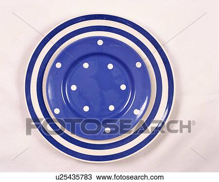 Close-up of blue spotted and striped plates View Large Photo Image Stock Image - Close-up of blue spotted and striped plates. Fotosearch