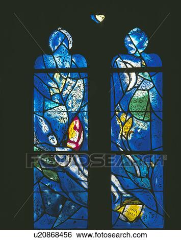 Stock Photograph - close-up of blue stained-glass Gothic window. Fotosearch