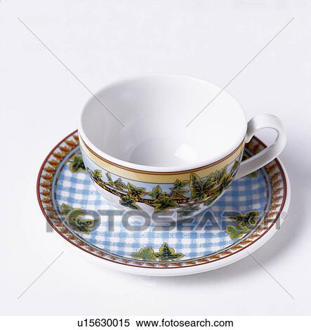 Stock Photography - Close-up of blue+white patterned china cup and saucer. Fotosearch