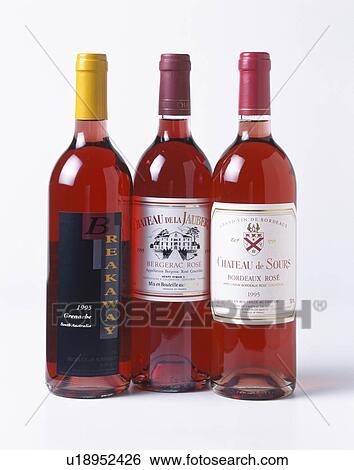 Stock Photograph - Close-up of bottles of rose wine. Fotosearch