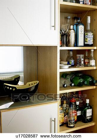 Close-up of bottles of wine and spirits on storage shelves View Large Photo Image Stock Photo - Close-up of bottles of wine and spirits on storage shelves. Fotosearch