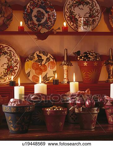 Close-up of candles in flowerpots decorated for Christmas View Large Photo Image Stock Photo - Close-up of candles in flowerpots decorated for Christmas. Fotosearch