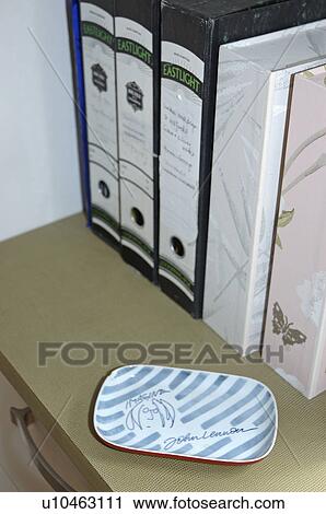 Close-up of ceramic dish on desk with box-files View Large Photo Image Stock Image - Close-up of ceramic dish on desk with box-files. Fotosearch