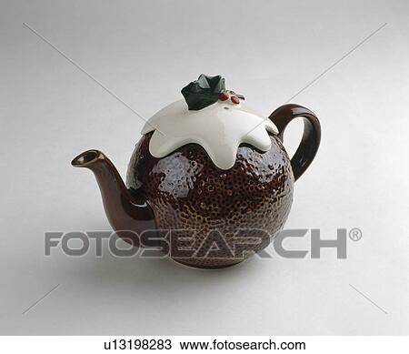 Stock Image - Close-up of Christmas pudding-shaped teapot. Fotosearch