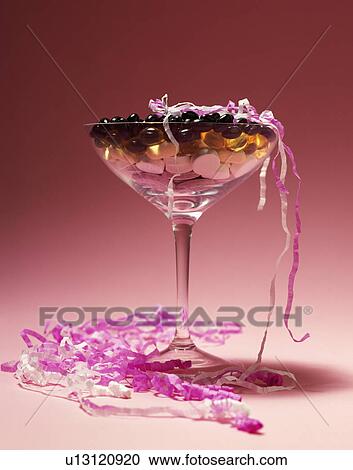 Close-up of cocktail glass with sugared almonds View Large Photo Image Stock Image - Close-up of cocktail glass with sugared almonds. Fotosearch