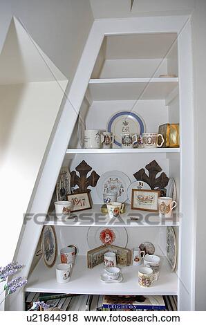Close-up of collection of antique china ornaments on white alcove shelves View Large Photo Image Stock Photo - Close-up of collection of antique china ornaments on white alcove shelves. Fotosearch