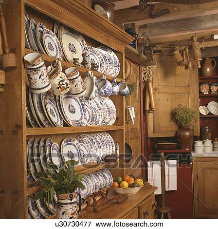 Close-up of collection of blue+white china on pine dresser View Large Photo Image Stock Photo - Close-up of collection of blue+white china on pine dresser. Fotosearch