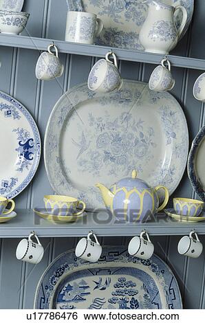 Close-up of collection of blue+white antique china on blue shelves View Large Photo Image Stock Photograph - Close-up of collection of blue+white antique china on blue shelves. Fotosearch