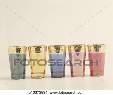 Close-up of colourful glass Moroccan tea-glasses with gold rims View Large Photo Image Picture - Close-up of colourful glass Moroccan tea-glasses with gold rims. Fotosearch