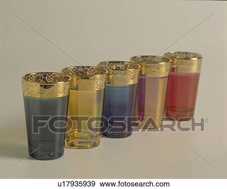 Stock Photo - Close-up of colourful glass Moroccan tea-glasses with gold rims. Fotosearch