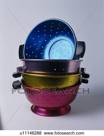 Close-up of colourful metallic colanders View Large Photo Image Stock Photo - Close-up of colourful metallic colanders. Fotosearch