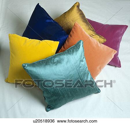 Stock Photograph - Close-up of colourful velvet and silk cushions. Fotosearch