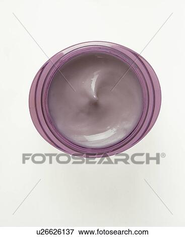 Stock Photo - Close-up of cosmetic cream in mauve pot. Fotosearch