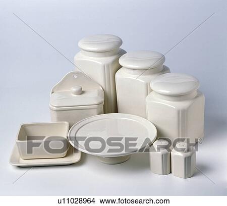 Close-up of cream lidded ceramic storage jars with matching butter-dish and salt+pepper shakers View Large Photo Image Picture - Close-up of cream lidded ceramic storage jars with matching butter-dish and salt+pepper shakers. Fotosearch