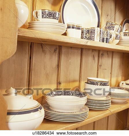 Close-up of crockery on pine shelves View Large Photo Image Picture - Close-up of crockery on pine shelves. Fotosearch