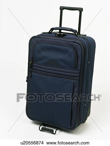 Picture - Close-up of dark blue wheeled suitcase. Fotosearch