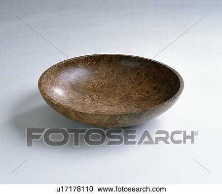 Stock Image - Close-up of dark wood bowl. Fotosearch