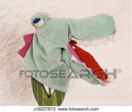 Stock Image - Close-up of dragon hand-puppet. Fotosearch