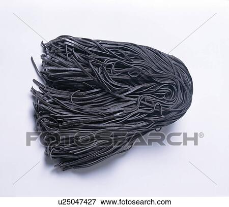 Close-up of dried black pasta View Large Photo Image Stock Photo - Close-up of dried black pasta. Fotosearch