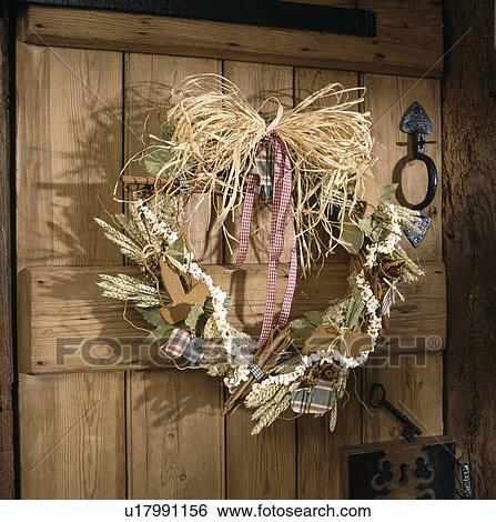 Stock Photograph - Close-up of dried flower and spices Shaker-style natural Christmas wreath. Fotosearch