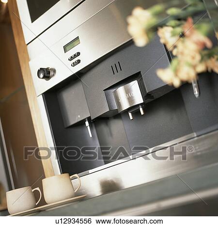 Close-up of electric coffee machine and cups View Large Photo Image Stock Photograph - Close-up of electric coffee machine and cups. Fotosearch