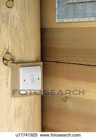 Close-up of electric light switch on vertical wooden beam View Large Photo Image Stock Photography - Close-up of electric light switch on vertical wooden beam. Fotosearch