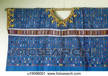 Stock Image - Close-up of embroidered blue wall-hanging. Fotosearch