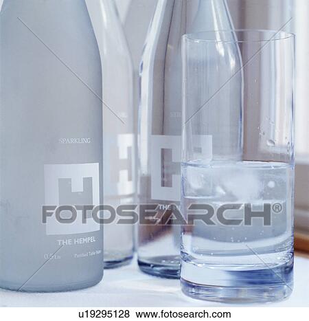 Close-up of engraved glass bottles and water glass at The Hempel Hotel View Large Photo Image Stock Photo - Close-up of engraved glass bottles and water glass at The Hempel Hotel. Fotosearch