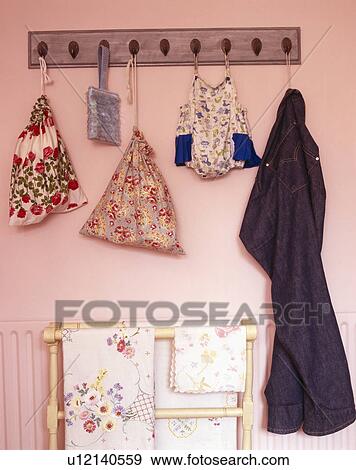 Close-up of fabric storage bags on pegboard View Large Photo Image Stock Photo - Close-up of fabric storage bags on pegboard. Fotosearch