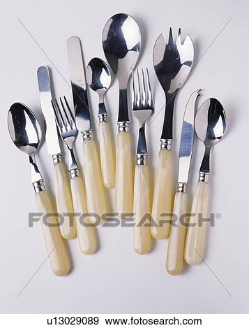 Close-up of faux-bone-handled knives and forks with spoons View Large Photo Image Stock Photo - Close-up of faux-bone-handled knives and forks with spoons. Fotosearch