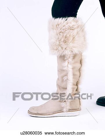Close-up of faux-fur and suede leather woman's knee-length boot View Large Photo Image Stock Photography - Close-up of faux-fur and suede leather woman's knee-length boot. Fotosearch