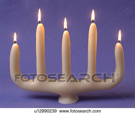 Close-up of five-pronged lighted candle View Large Photo Image Stock Photo - Close-up of five-pronged lighted candle. Fotosearch
