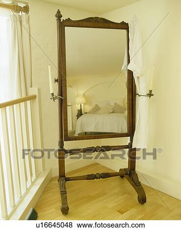 Close-up of freestanding Cheval mirror View Large Photo Image Stock Photo - Close-up of freestanding Cheval mirror. Fotosearch