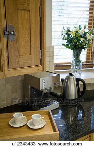 Close-up of Gaggia Cubika coffee machine and stainless steel kettle beside wooden tray with white coffee cups View Large Photo Image Stock Image - Close-up of Gaggia Cubika coffee machine and stainless steel kettle beside wooden tray with white coffee cups. Fotosearch