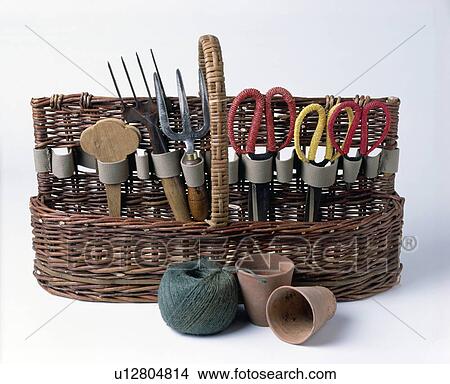 Picture - Close-up of gardening hand-tools and scissors in basket storage. Fotosearch