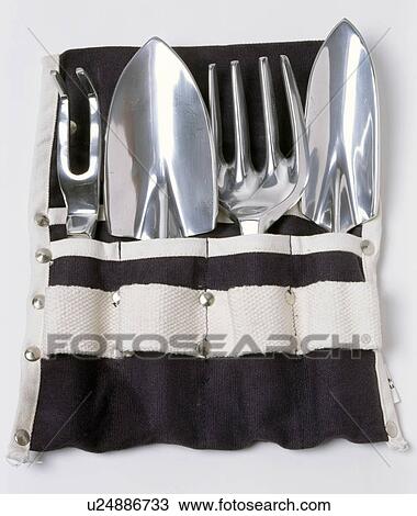 Close-up of gardening hand-tools in blac+white canvas holder View Large Photo Image Stock Image - Close-up of gardening hand-tools in blac+white canvas holder. Fotosearch