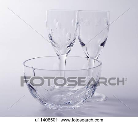 Close-up of glass bowl and two wine-glasses View Large Photo Image Stock Image - Close-up of glass bowl and two wine-glasses. Fotosearch