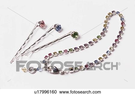Close-up of glass jewelled necklace and hair-pieces View Large Photo Image Stock Image - Close-up of glass jewelled necklace and hair-pieces. Fotosearch