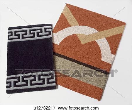 Close-up of Greek-key patterned carpet swatch with terracotta patterned swatch View Large Photo Image Stock Photo - Close-up of Greek-key patterned carpet swatch with terracotta patterned swatch. Fotosearch